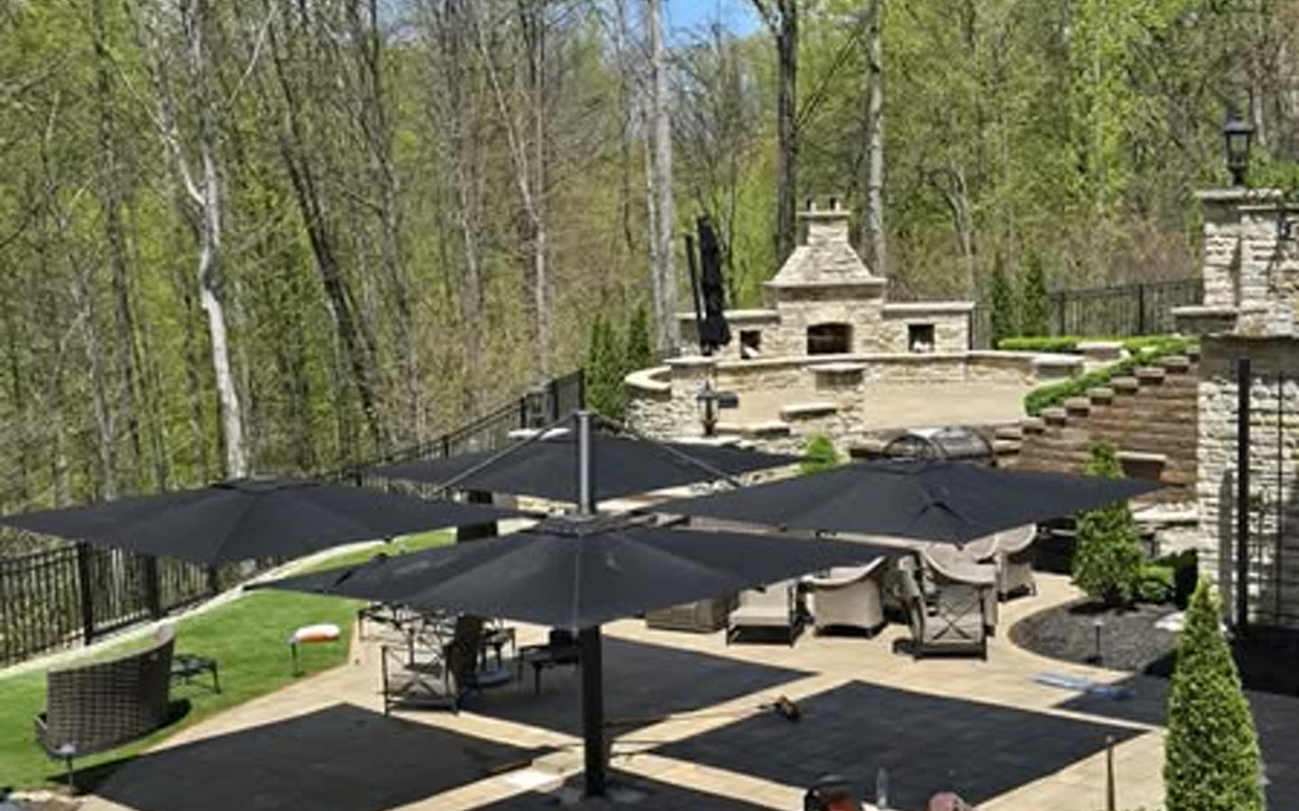 Complete backyard design with patios, fire feature, planting, and gathering spaces