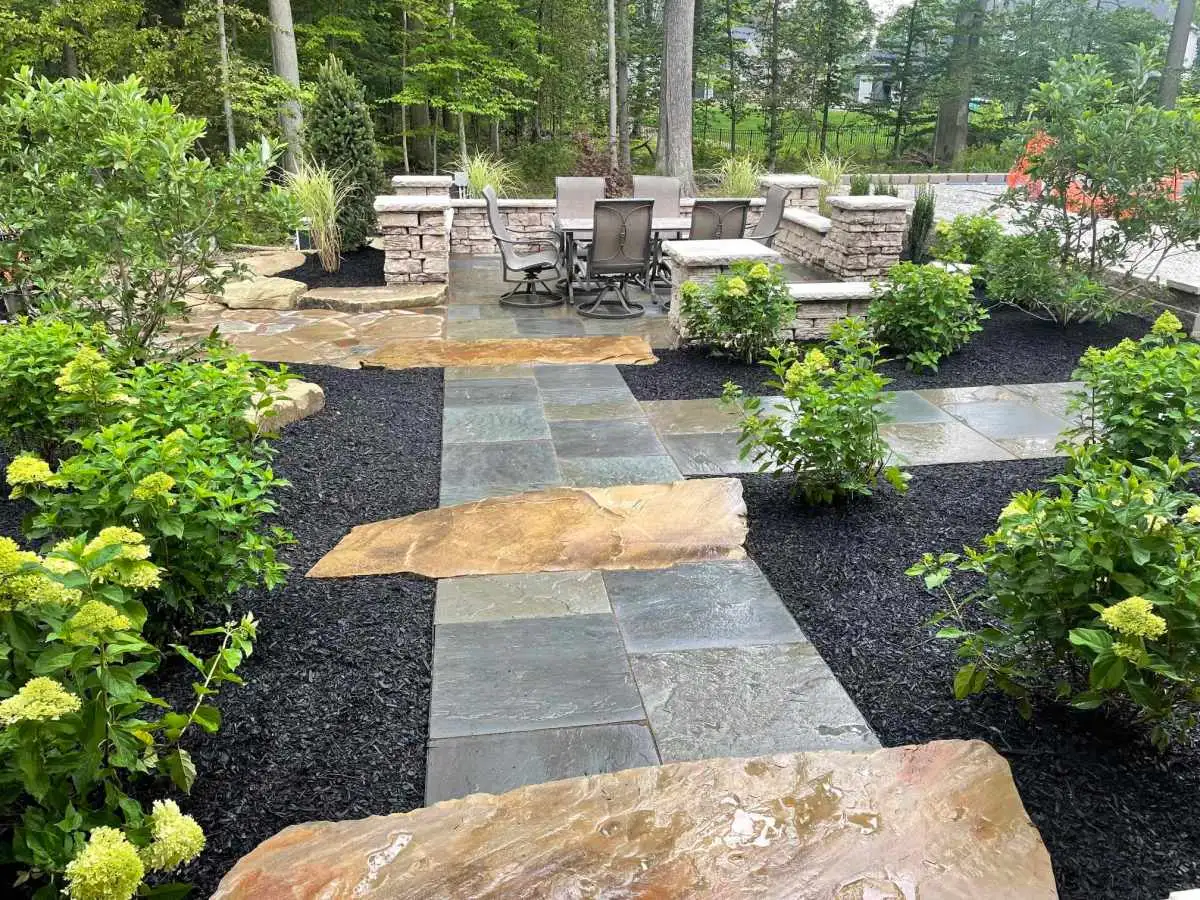 Flagstone walkway to patio with plantings