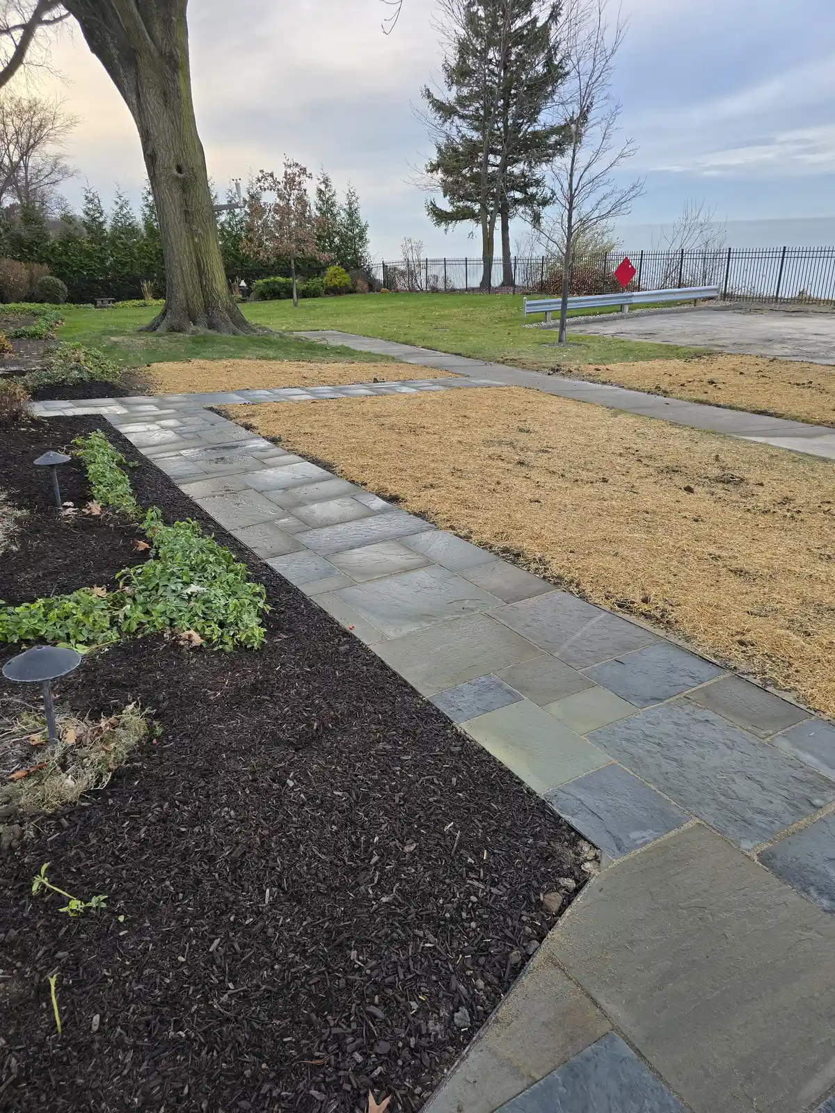Backyard hardscape area planned for outdoor dining and relaxing