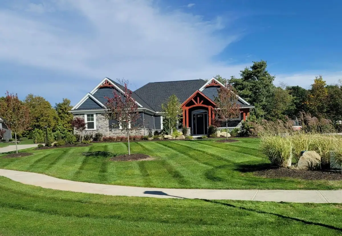 Residential lawn care with striped mowing pattern